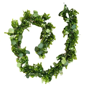 Artificial eucalyptus vine with green leaves and white flower clusters for home decor