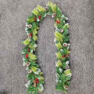 Detailed texture of 2.7m Christmas pine garland with snow needles, cones and red berries