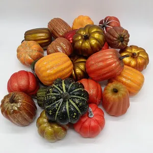 Detailed top view of assorted artificial pumpkins for harvest and Halloween decor