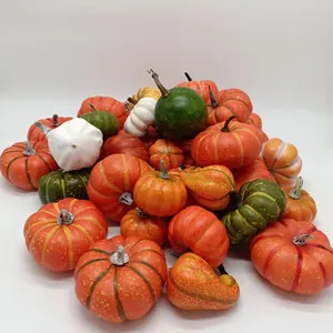 Close-up of decorative artificial pumpkins and gourds with realistic textures and colors