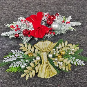 Close-up of festive Christmas teardrop swags with velvet bows and pine needles