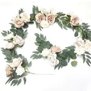 Detailed close-up of realistic champagne and white silk roses with eucalyptus leaves vine