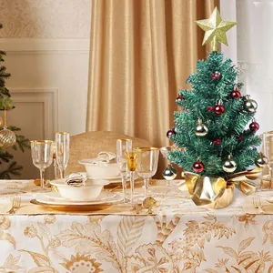Detailed view of 24-inch mini tabletop Christmas tree with red silver balls and gold star