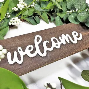 Rustic wood welcome sign with artificial eucalyptus leaves and white berries for wall hanging