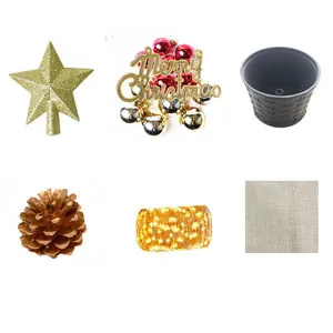 Detailed flat lay of 24-inch mini Christmas tree DIY ornaments with LED lights and star