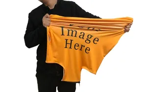 Close-up showing the high elasticity and stretch of the orange polyester luggage cover