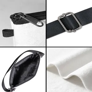 Detail view of white felt tote featuring black zipper, metal buckle, and woven strap texture
