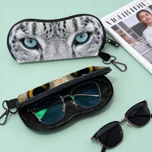 Detail of portable leopard eye print eyewear pouch with secure zipper and metal clip