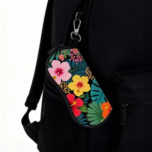 Detail of floral pouch with metal hook attached to a black backpack as an accessory