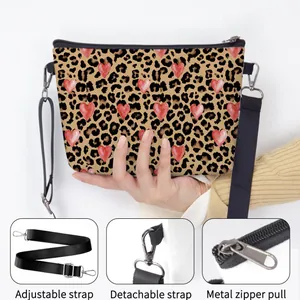 Brown leopard print shoulder bag with red hearts featuring adjustable black strap