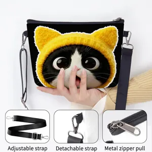Cute black shoulder bag with cat print featuring adjustable strap and metal zipper