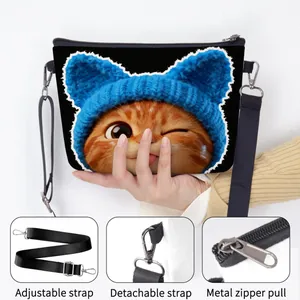 Cute canvas shoulder bag with orange cat print, featuring adjustable strap and metal zipper