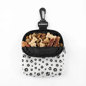 Close-up of portable pet snack pouch with paw print and black swivel hook clip