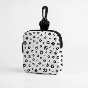 Detail of camouflage dog treat bag with claw prints, zipper and swivel carabiner hook