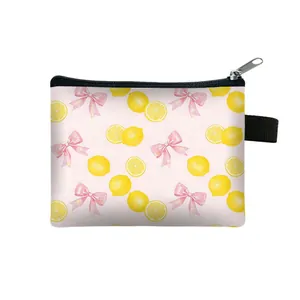 Mini portable coin purse with lemon and bow print featuring a secure zipper closure