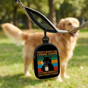 Dog treat pouch with funny cat print and hook attached to a leash in the park