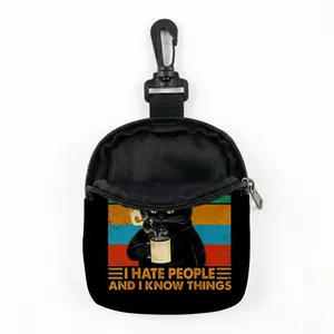 Detail view of durable black fabric dog treat pouch with carabiner and cat graphic