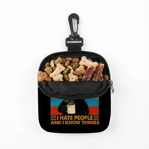 Detail of black pet treat pouch showing internal storage and durable plastic swivel hook