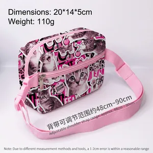 Detail view of pink crossbody bag with cat prints and adjustable strap dimensions