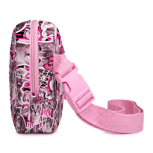 Side view of pink cat print crossbody bag with adjustable strap and zip closure