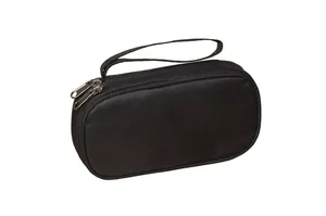 Detail of durable black nylon travel organizer with double metal zippers and carrying strap
