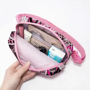 Interior view of leopard print waist bag showing large capacity for phone and essentials