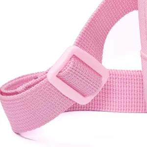 Detailed close-up of pink woven nylon shoulder strap with adjustable plastic buckle