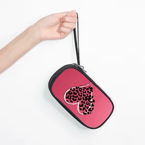 Pink leopard print travel pouch with wrist strap and heart pattern organizer