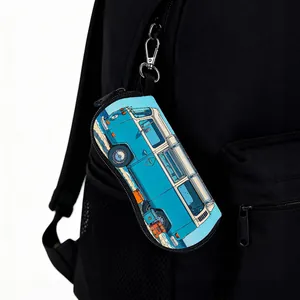 Detail of camper van printed sunglasses case clipped to a backpack with a metal carabiner