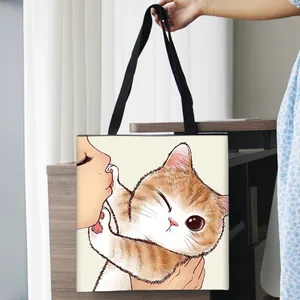Polyester tote bag featuring a cute girl and orange cat print with black shoulder straps