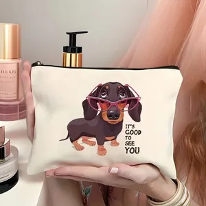 Detail of dachshund printed canvas makeup bag with It's Good To See You quote