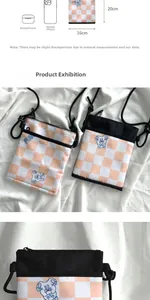 Detail view of orange plaid crossbody phone bag with cute bear and dimension labels