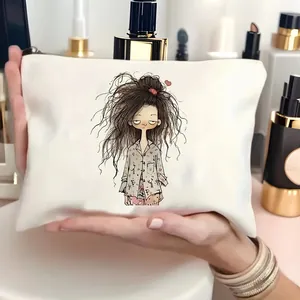 Detail of white canvas makeup bag featuring a cartoon girl illustration and metal zipper