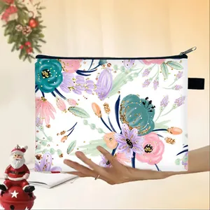 Close-up of floral cosmetic bag with watercolor flowers and gold foil accents