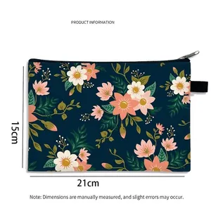 Floral makeup bag with large capacity and zipper closure in navy blue with pink flowers