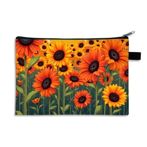 Detail view of sunflower print makeup bag with smooth zipper closure and side hanging loop