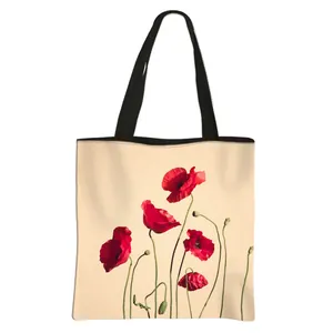 Floral polyester tote bag with red poppy print and black canvas handles for women