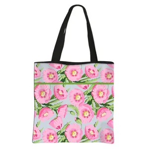 Floral canvas tote bag with pink poppy print and blue background for women stylish bag