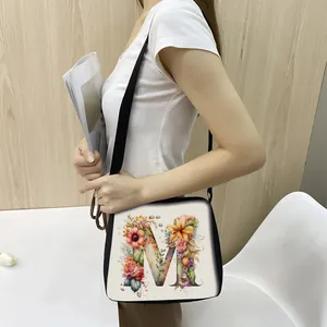 Minimalist white tote bag with floral letter M print and black handles for fashion women