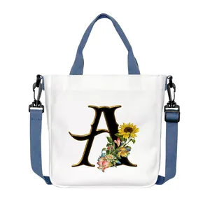Borsa tote in tela bianca con lettera A di girasole e tracolla blu regolabile in altezza