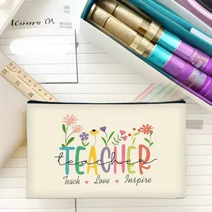 Detail of floral Teacher print on cream makeup bag with Teach Love Inspire quote