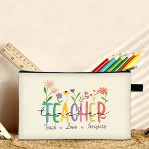 Detail of canvas makeup bag with floral print and Teach Love Inspire quote for teachers