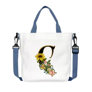 Borsa tote in tela bianca con lettera C a fiori e tracolla regolabile e rimovibile