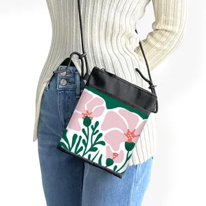 Mini floral crossbody phone bag with artistic pink flower print and adjustable strap
