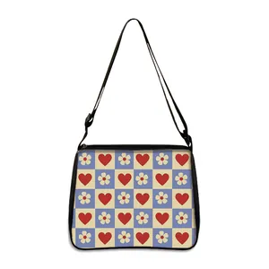 Checkerboard shoulder bag with red hearts and flowers, adjustable strap and zipper closure
