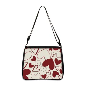 Minimalist white shoulder bag with red heart pattern and adjustable black strap for women