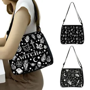 Detail of black crossbody bag with white gothic prints and adjustable strap for women