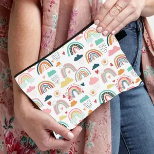 Rainbow bohemian print waterproof cosmetic bag held by a model for travel storage