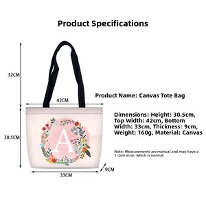 Detailed size chart for pink floral letter A canvas tote bag with dimensions and weight