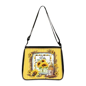 Sunflower and bee print tote bag with yellow accents and adjustable shoulder strap